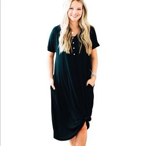Brand new nesting olive dress in black.